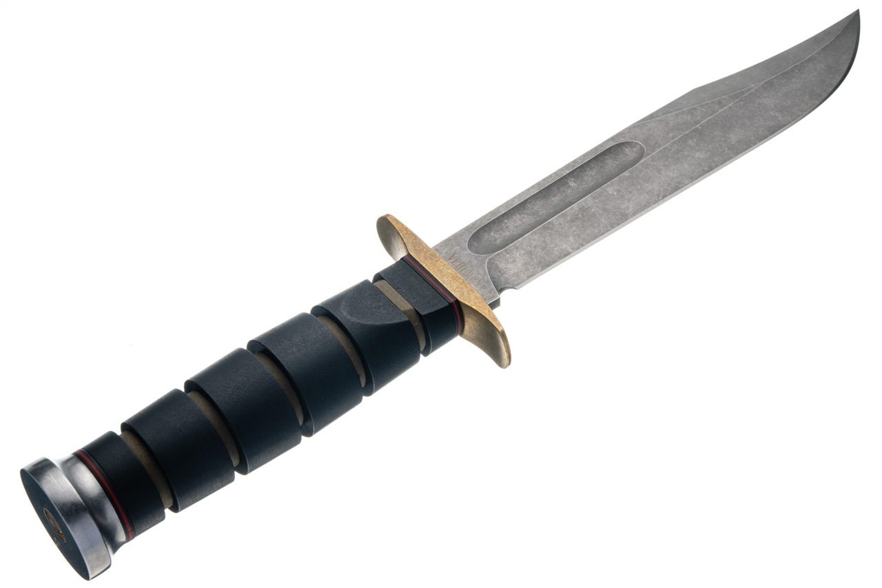 Close detail of the Black Canvas Micarta handle, brass guard and pommel