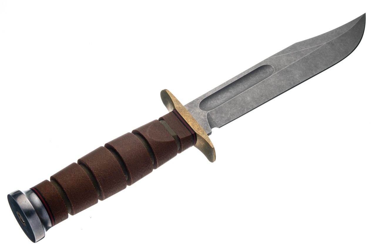 Close detail of the Natural Canvas Micarta handle, brass guard and pommel